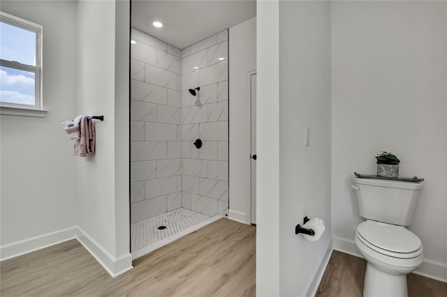 9739 Loretto St, Spring Hill, FL 34608 - full bathroom with tiled shower, wood finished floors, and recessed lighting