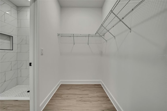 9739 Loretto St, Spring Hill, FL 34608 - walk in closet with wood finished floors
