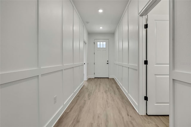 9739 Loretto St, Spring Hill, FL 34608 - hall with light wood-style flooring and recessed lighting