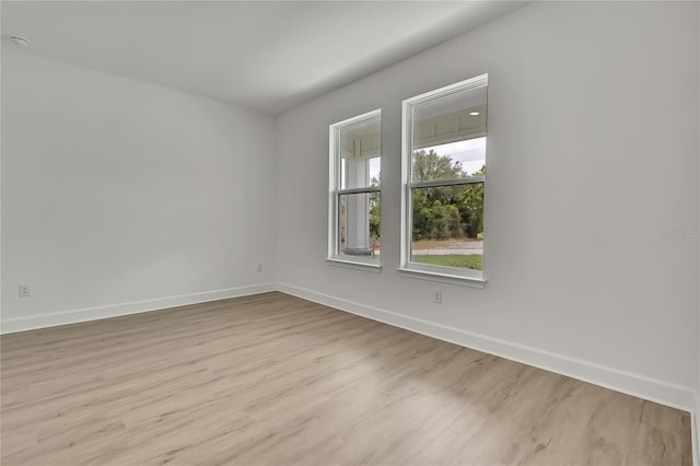 9739 Loretto St, Spring Hill, FL 34608 - unfurnished room featuring baseboards and light wood-type flooring