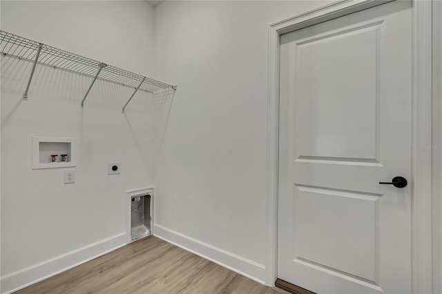 9739 Loretto St, Spring Hill, FL 34608 - laundry area with hookup for a washing machine, hookup for an electric dryer, and light wood-type flooring