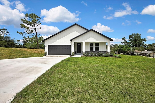 9739 Loretto St, Spring Hill, FL 34608 - view of front facade featuring board and batten siding, an attached garage, driveway, and a front yard