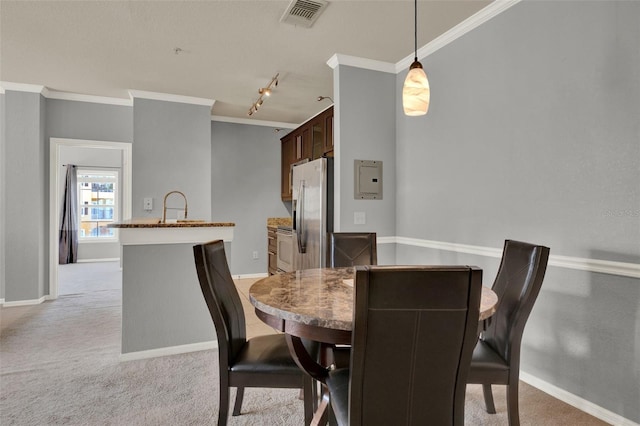 3757 Conroy Rd Unit 2525, Orlando, FL 32839 - dining space featuring ornamental molding, track lighting, and light carpet