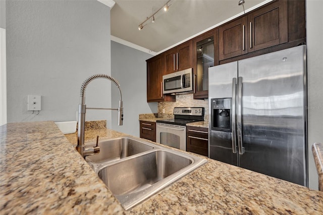 3757 Conroy Rd Unit 2525, Orlando, FL 32839 - kitchen with stainless steel appliances, backsplash, glass insert cabinets, dark brown cabinets, and ornamental molding