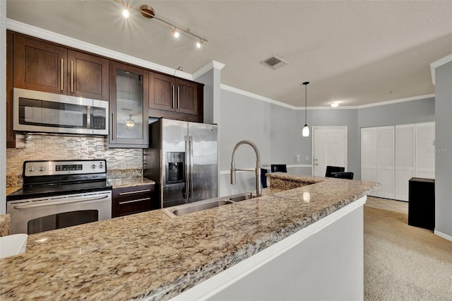 3757 Conroy Rd Unit 2525, Orlando, FL 32839 - kitchen with appliances with stainless steel finishes, tasteful backsplash, dark brown cabinetry, crown molding, and glass insert cabinets