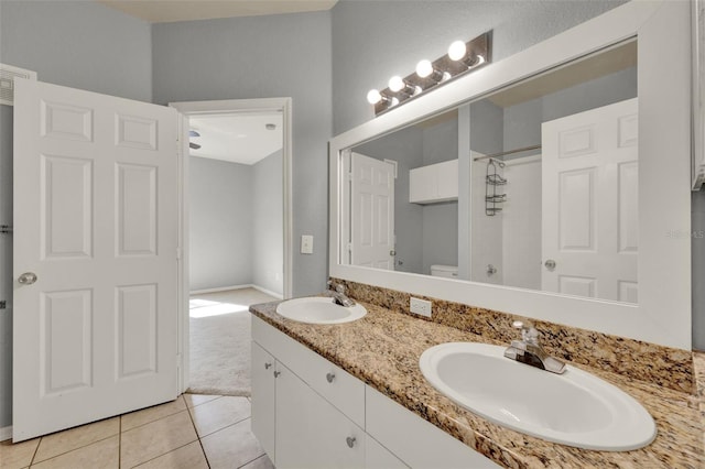 3757 Conroy Rd Unit 2525, Orlando, FL 32839 - bathroom featuring double vanity, a shower, and tile patterned floors