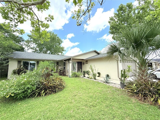 11310 Darlington Dr, Orlando, FL 32837 - view of front of house with stucco siding, a garage, and a front yard