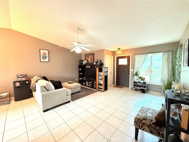 11310 Darlington Dr, Orlando, FL 32837 - living area with a textured ceiling, light tile patterned flooring, ceiling fan, and vaulted ceiling