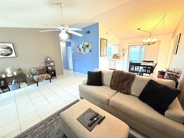 11310 Darlington Dr, Orlando, FL 32837 - living area with lofted ceiling, a chandelier, light tile patterned flooring, a ceiling fan, and a textured ceiling