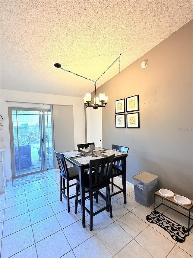 11310 Darlington Dr, Orlando, FL 32837 - dining space featuring a chandelier, a textured ceiling, light tile patterned floors, and lofted ceiling