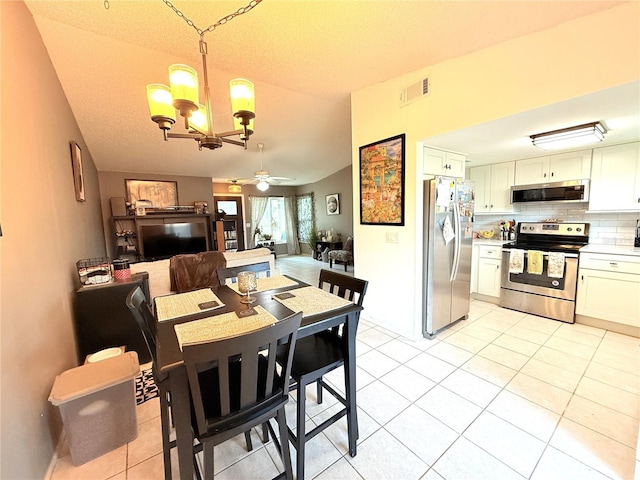 11310 Darlington Dr, Orlando, FL 32837 - dining area with a chandelier, light tile patterned floors, and ceiling fan