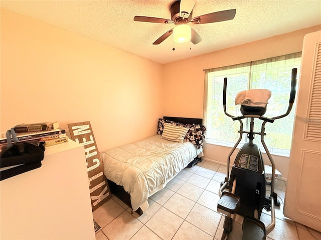 11310 Darlington Dr, Orlando, FL 32837 - bedroom featuring a textured ceiling, light tile patterned floors, and ceiling fan