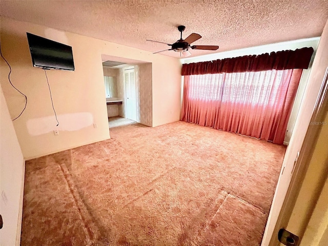 8547 Cedar Cove Dr, Orlando, FL 32819 - unfurnished living room featuring carpet floors, a ceiling fan, and a textured ceiling