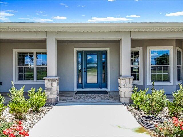 14243 County Road 450, Umatilla, FL 32784 - entrance to property with covered porch and stucco siding