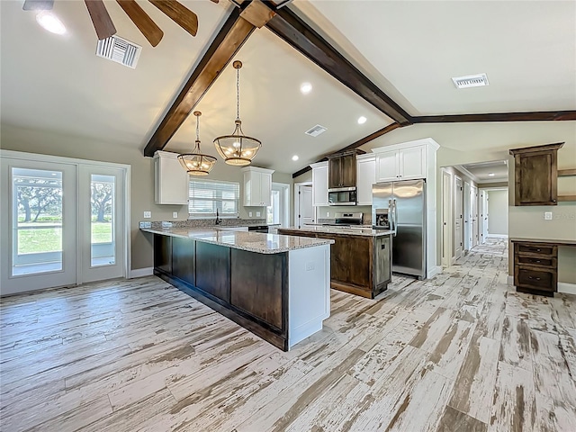 14243 County Road 450, Umatilla, FL 32784 - kitchen with stainless steel appliances, white cabinetry, a chandelier, light wood-style floors, and recessed lighting