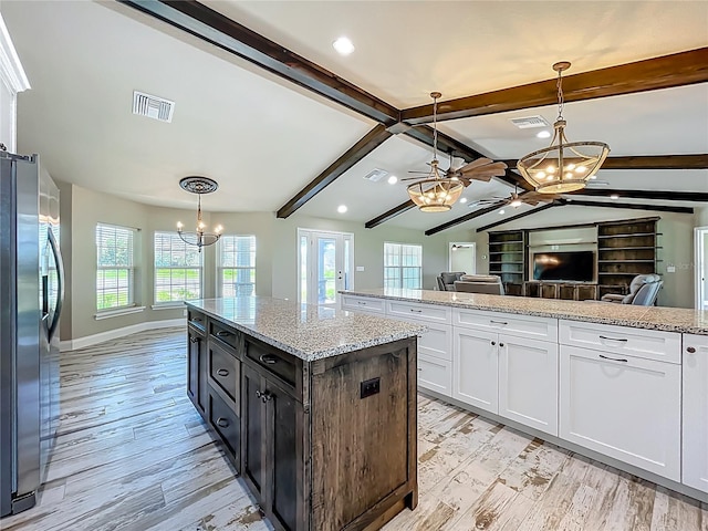 14243 County Road 450, Umatilla, FL 32784 - kitchen featuring a chandelier, stainless steel refrigerator with ice dispenser, white cabinets, healthy amount of natural light, and recessed lighting
