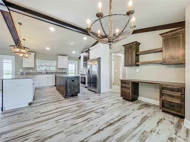 14243 County Road 450, Umatilla, FL 32784 - kitchen with stainless steel fridge with ice dispenser, a chandelier, wall oven, open shelves, and a kitchen island