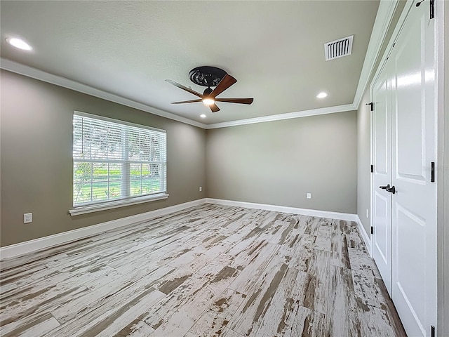 14243 County Road 450, Umatilla, FL 32784 - spare room with ceiling fan, ornamental molding, wood finished floors, and recessed lighting