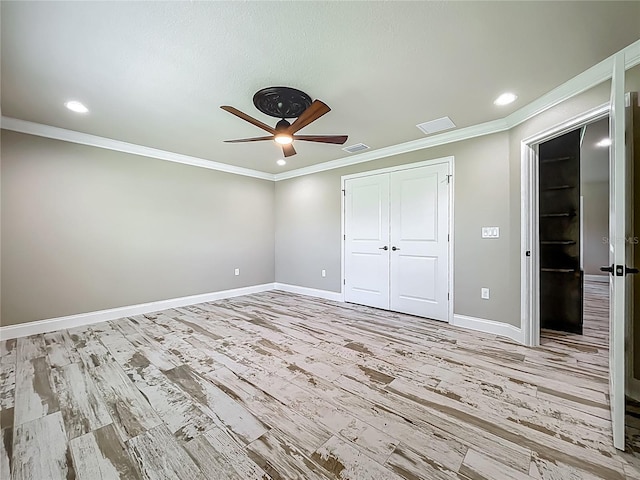 14243 County Road 450, Umatilla, FL 32784 - unfurnished bedroom featuring crown molding, wood finished floors, recessed lighting, a closet, and a ceiling fan