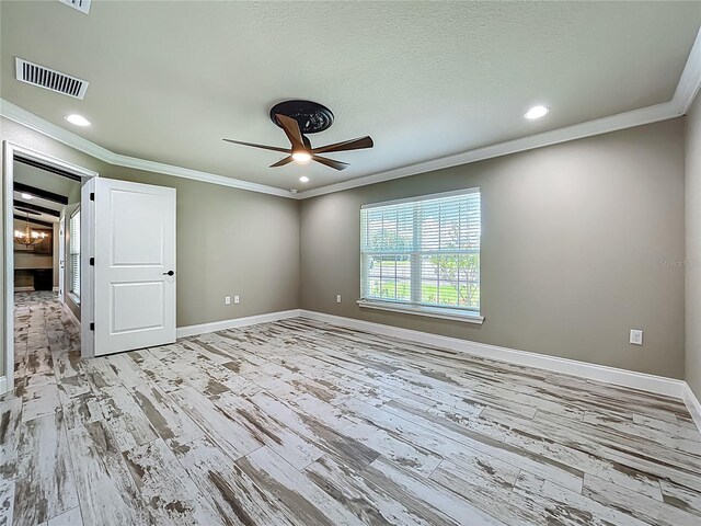14243 County Road 450, Umatilla, FL 32784 - unfurnished bedroom with ornamental molding, recessed lighting, light wood finished floors, a ceiling fan, and a chandelier