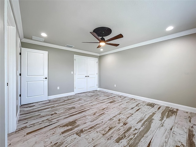 14243 County Road 450, Umatilla, FL 32784 - unfurnished bedroom with light wood finished floors, ornamental molding, a closet, recessed lighting, and ceiling fan