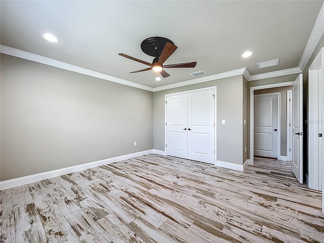14243 County Road 450, Umatilla, FL 32784 - unfurnished bedroom featuring light wood finished floors, a closet, recessed lighting, ceiling fan, and crown molding