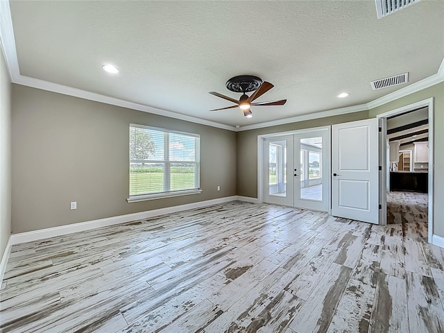 14243 County Road 450, Umatilla, FL 32784 - unfurnished room with crown molding, french doors, light wood-type flooring, ceiling fan, and recessed lighting