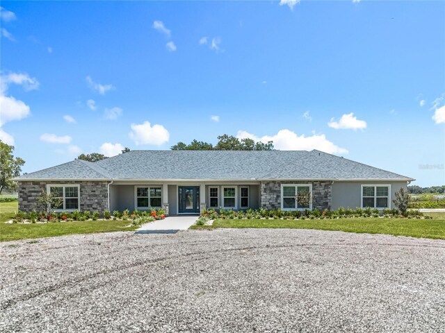 14243 County Road 450, Umatilla, FL 32784 - ranch-style house featuring stucco siding and stone siding