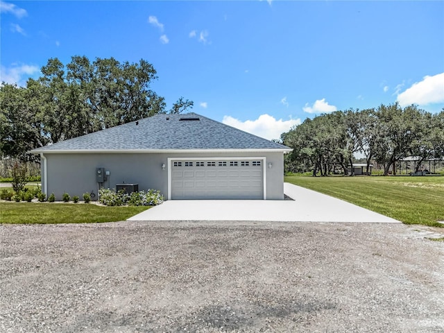 14243 County Road 450, Umatilla, FL 32784 - view of home's exterior with concrete driveway, a lawn, an attached garage, and stucco siding