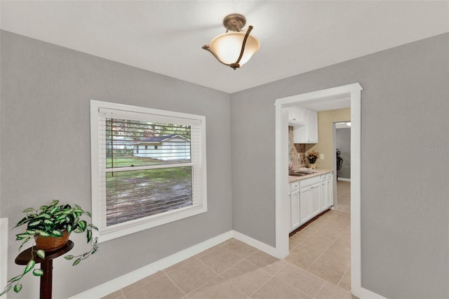 1506 S Elliott St, Sanford, FL 32771 - unfurnished room featuring light tile patterned floors and baseboards