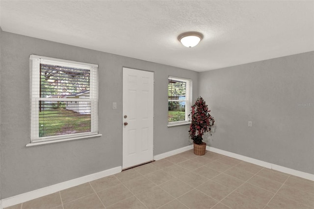 1506 S Elliott St, Sanford, FL 32771 - foyer entrance featuring a textured ceiling and light tile patterned floors