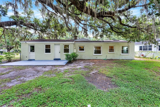 1506 S Elliott St, Sanford, FL 32771 - rear view of property with a patio area and stucco siding