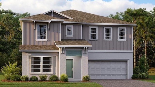 2877 Haze Rd, Clermont, FL 34714 - view of front facade with a garage, driveway, and board and batten siding