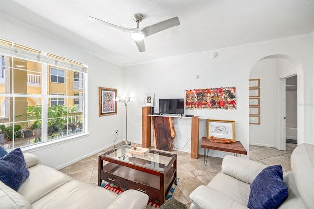 860 N Orange Ave Unit 210, Orlando, FL 32801 - living area with ornamental molding, arched walkways, plenty of natural light, light tile patterned floors, and a ceiling fan