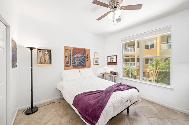 860 N Orange Ave Unit 210, Orlando, FL 32801 - bedroom with light tile patterned floors and ceiling fan
