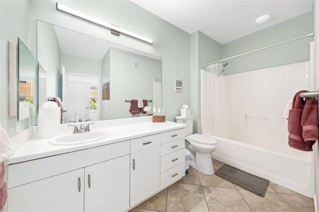 860 N Orange Ave Unit 210, Orlando, FL 32801 - bathroom with vanity, shower / bath combo with shower curtain, and tile patterned floors