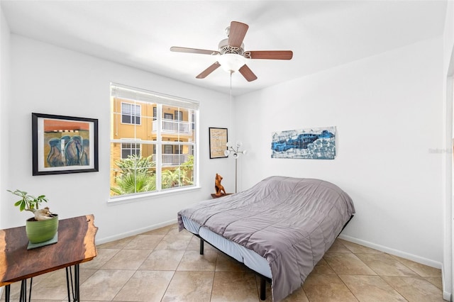 860 N Orange Ave Unit 210, Orlando, FL 32801 - bedroom with light tile patterned floors and ceiling fan