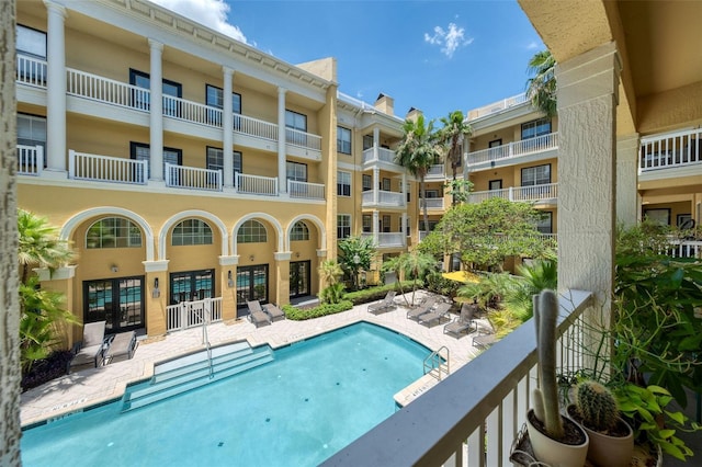 860 N Orange Ave Unit 210, Orlando, FL 32801 - community pool with french doors and a patio area