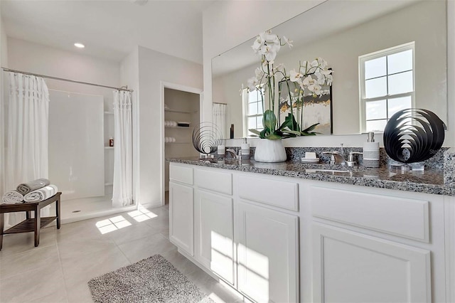 5157 Masser Rd, Saint Cloud, FL 34772 - full bathroom featuring a shower stall, double vanity, and tile patterned flooring