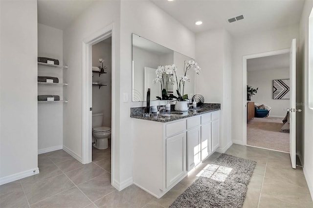 5157 Masser Rd, Saint Cloud, FL 34772 - ensuite bathroom featuring tile patterned floors, double vanity, and recessed lighting