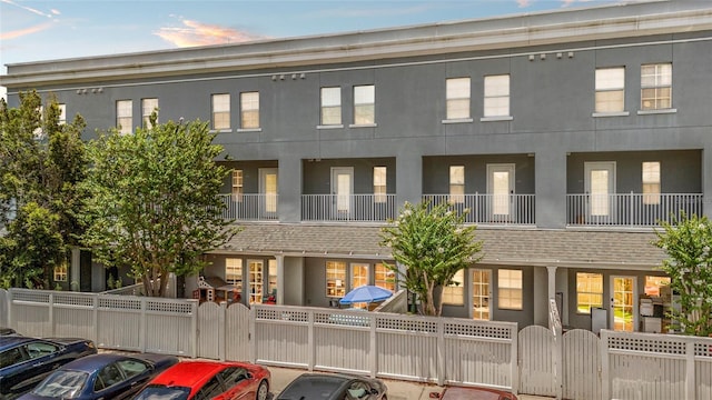 660 Celebration Ave Unit 250, Kissimmee, FL 34747 - view of front of house featuring a gate, uncovered parking, and a fenced front yard