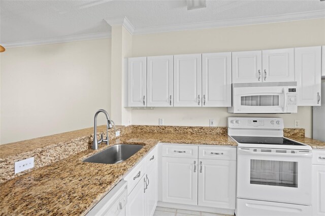 660 Celebration Ave Unit 250, Kissimmee, FL 34747 - kitchen featuring white appliances, ornamental molding, white cabinetry, and light stone countertops