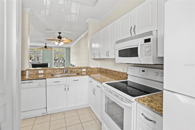 660 Celebration Ave Unit 250, Kissimmee, FL 34747 - kitchen with white appliances, ornamental molding, white cabinetry, a ceiling fan, and light tile patterned floors