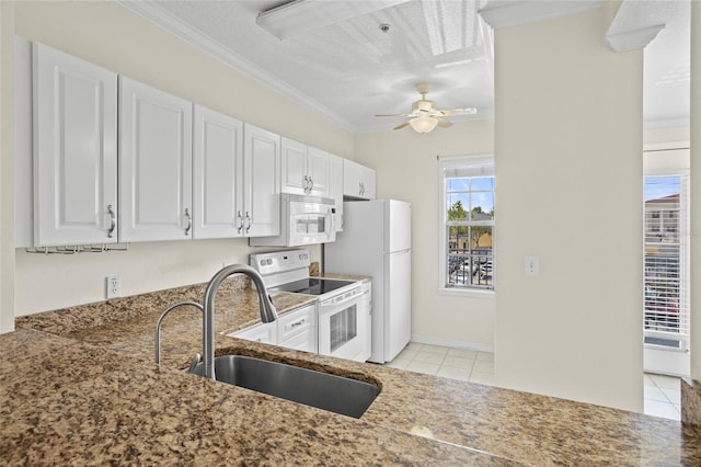 660 Celebration Ave Unit 250, Kissimmee, FL 34747 - kitchen with white appliances, light tile patterned floors, crown molding, stone counters, and ceiling fan