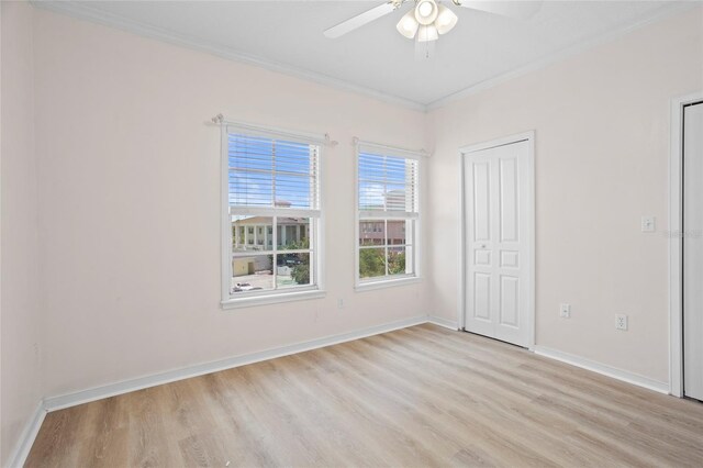660 Celebration Ave Unit 250, Kissimmee, FL 34747 - unfurnished bedroom with light wood-style flooring, crown molding, and a ceiling fan