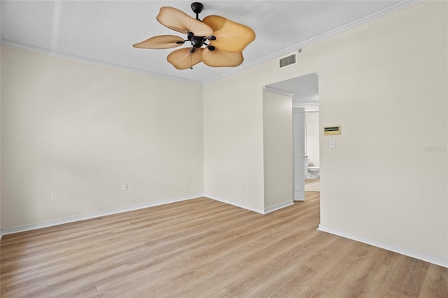 660 Celebration Ave Unit 250, Kissimmee, FL 34747 - empty room featuring a ceiling fan, light wood-style floors, and crown molding