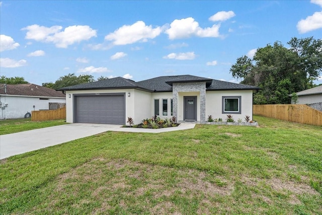 7160 Carlowe Ave, Cocoa, FL 32927 - prairie-style home featuring stucco siding, concrete driveway, and an attached garage