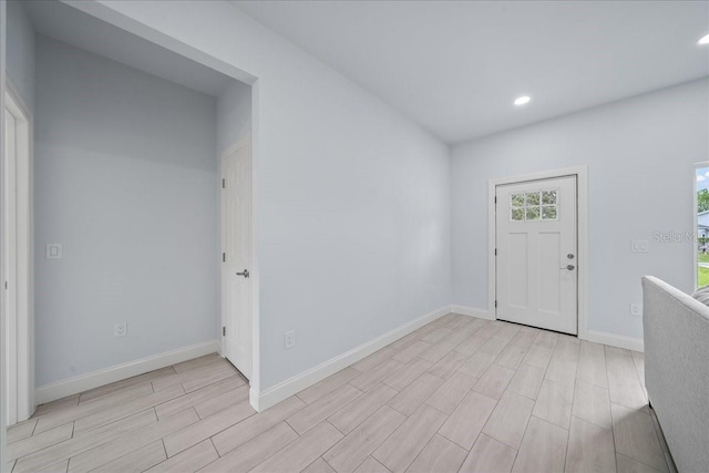 7160 Carlowe Ave, Cocoa, FL 32927 - foyer entrance with wood tiled floors and recessed lighting