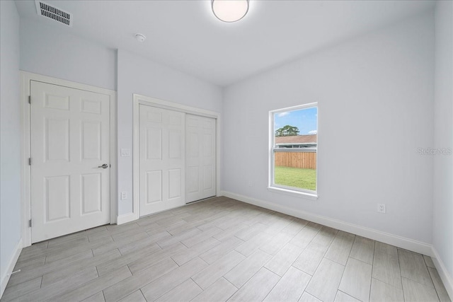 7160 Carlowe Ave, Cocoa, FL 32927 - unfurnished bedroom with a closet and light wood-style floors