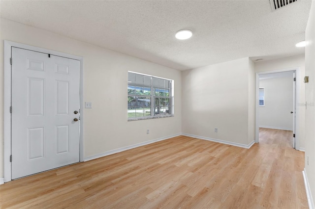 235 Ruth Blvd, Longwood, FL 32750 - foyer entrance featuring light wood-style flooring and a textured ceiling